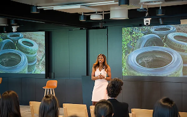 Caroline Flanagan speaking at a corporate event on Imposter Syndrome and inclusive leadership for law firms