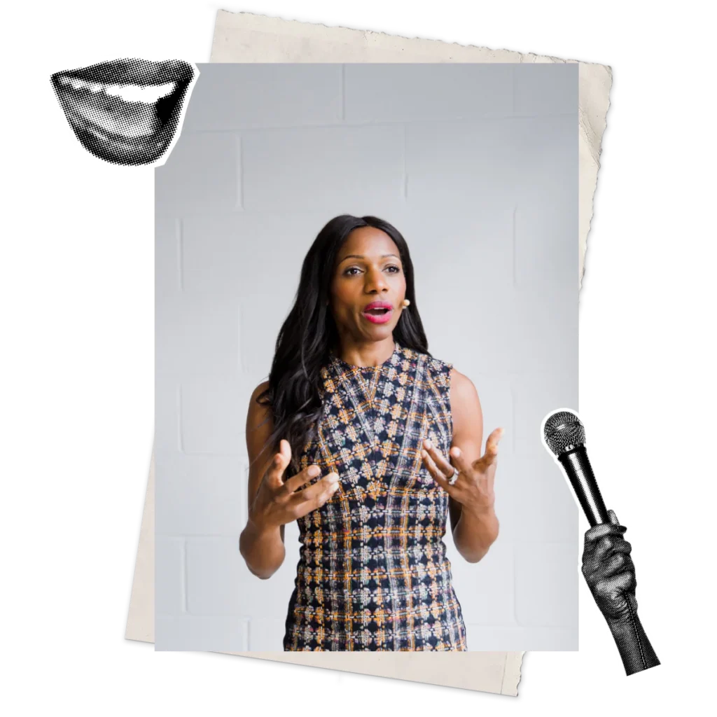 Caroline Flanagan mid-keynote, gesturing expressively while speaking on Imposter Syndrome and inclusive leadership